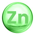 Sfera verde con scritta Zn rappresentante lo zinco minerale su sfondo bianco.