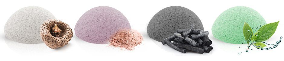 quattro spugna multicolore con konjac su uno sfondo bianco quattro spugna multicolore con konjac su uno sfondo bianco